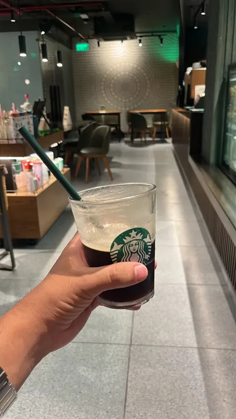 Holding a cold brew at Starbucks