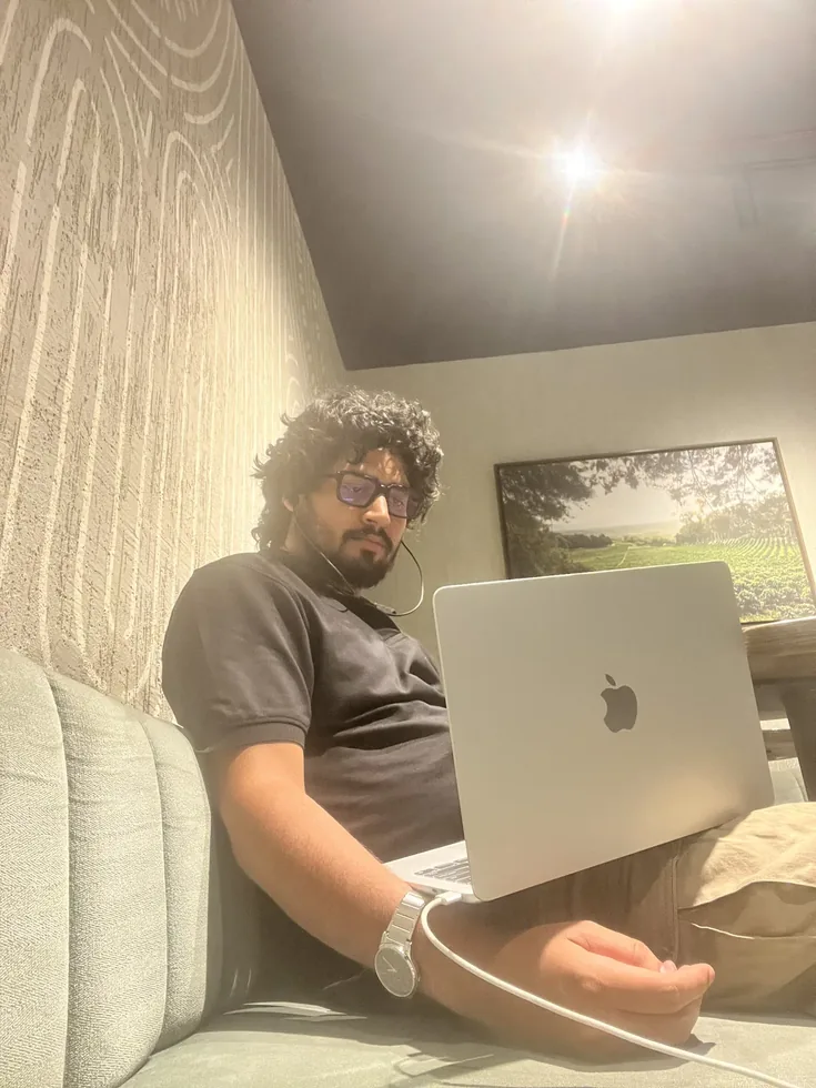 Azfar working on his laptop at Starbucks